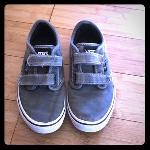 Grey Velcro Vans shoes.
